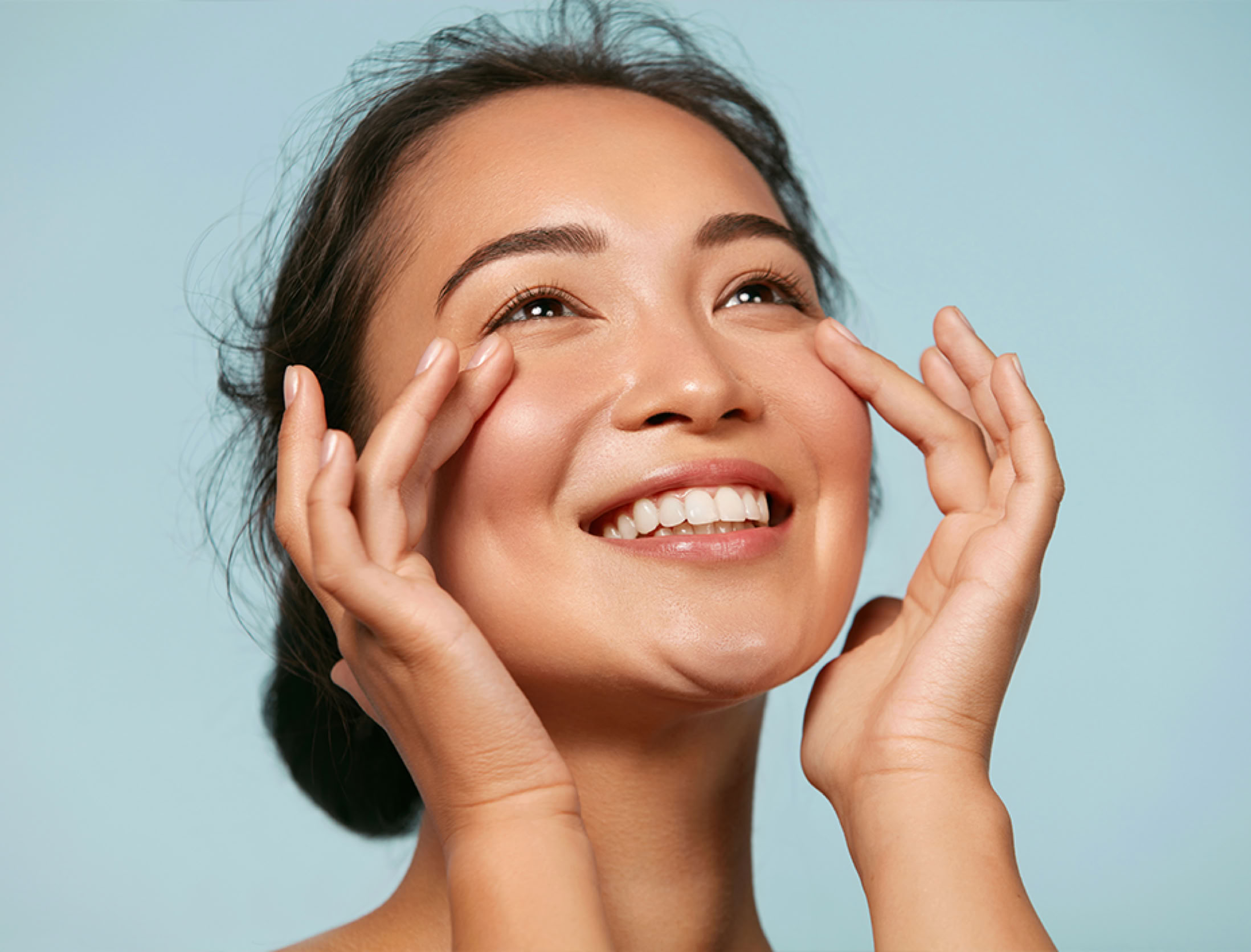 Woman with radiant glowing skin representing holistic beauty, personalized skincare, and wellness treatments at Shasta Destination Skin.